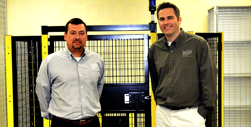 Folding Guard’s Pat McMahon (left) and Jason Wynne shown with Saf-T-Fence®, a modular system of steel posts, wire mesh panels, and doors to protect automated machinery and the people who operate it. 